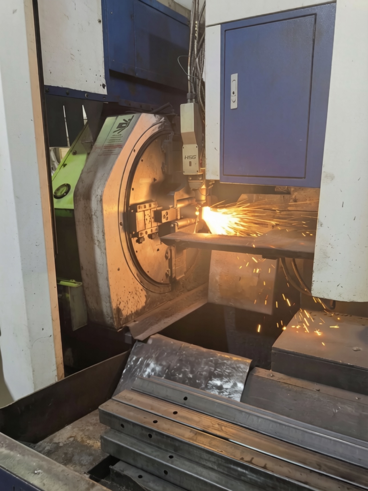 Laser cutting machine cutting sheet steel in operation